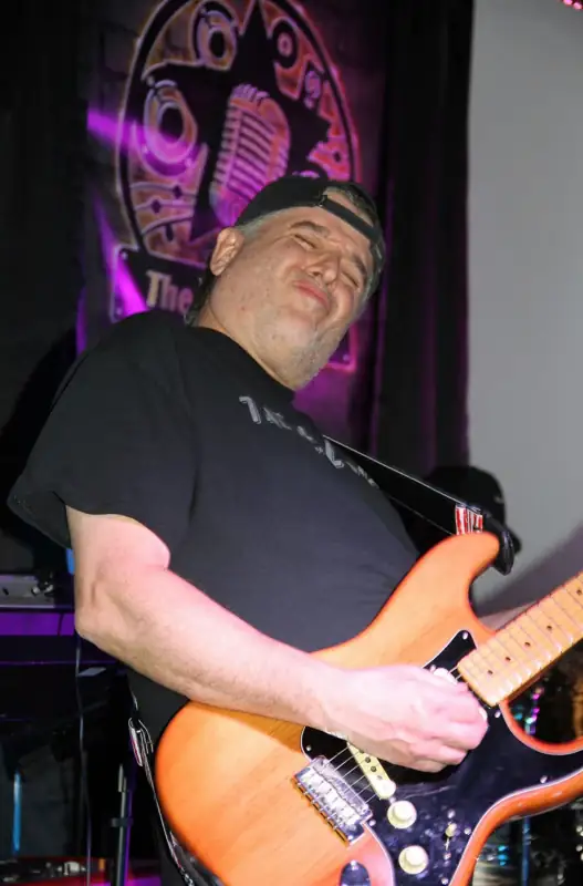 Eddy Melendez performing with The Real Deal
