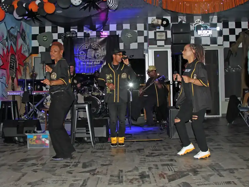 The Real Deal vocalists performing live
